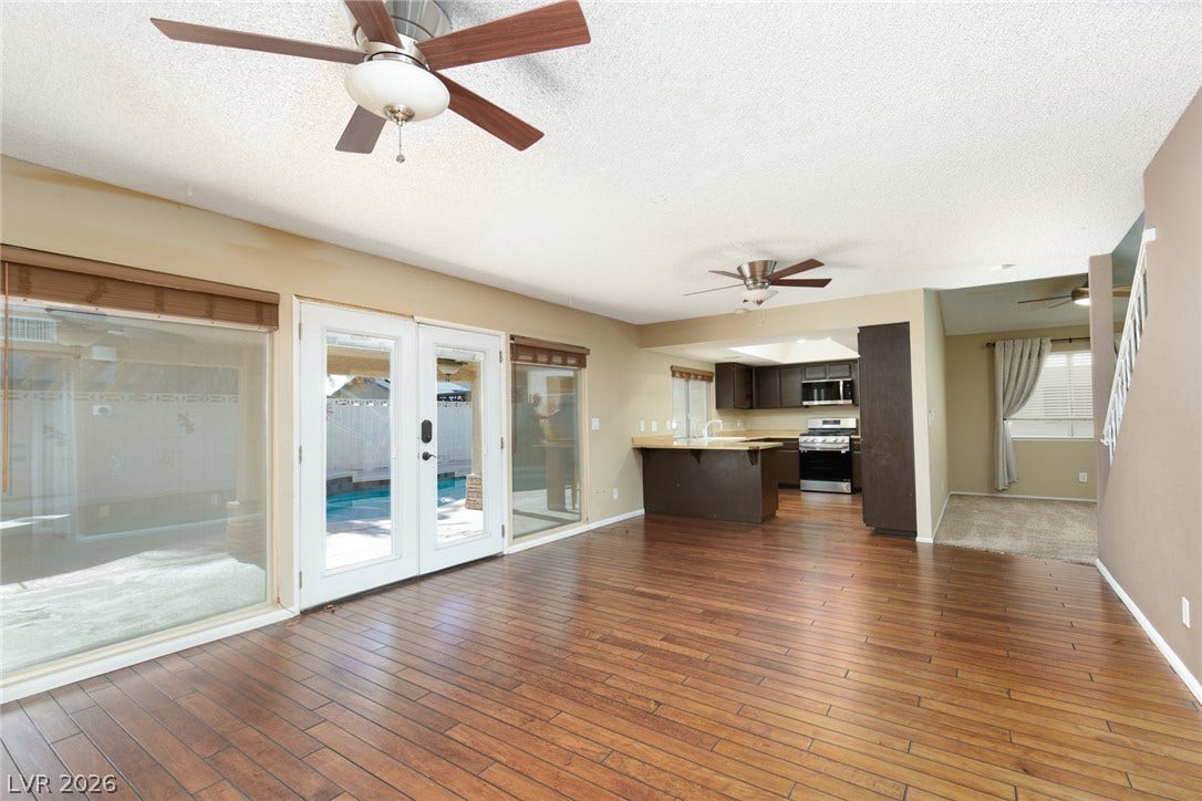 737 Brick Drive, Henderson, NV 89002 Rich wood floors sweep through a versatile open layout connected to the outdoors.