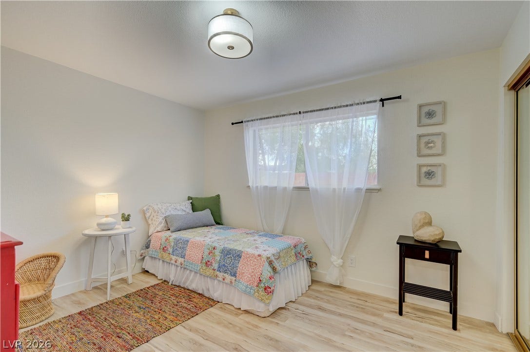 2101 Santiago Street, Las Vegas, NV 89104 Natural light streams through a wide window, highlighting the beautiful light wood flooring.