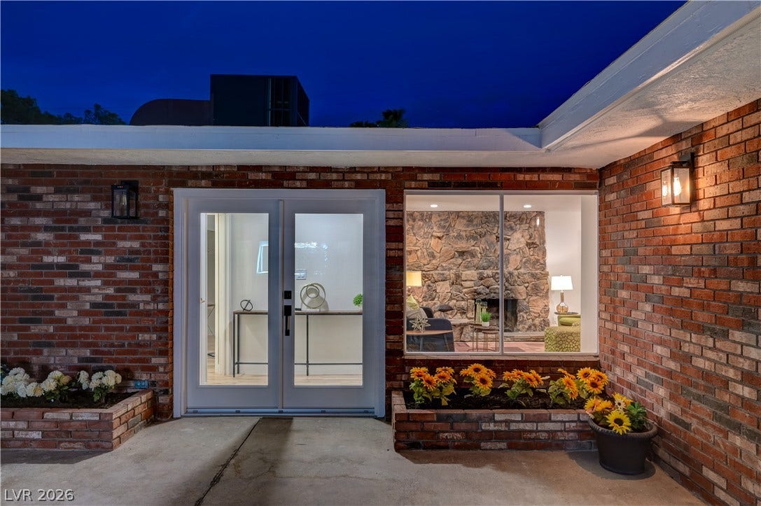 2101 Santiago Street, Las Vegas, NV 89104 Mid-century modern brick exterior featuring a glass entry door and an expansive picture window.
