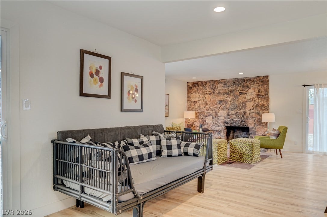 2101 Santiago Street, Las Vegas, NV 89104 An open floorplan flows seamlessly into a cozy living area defined by a stone fireplace.