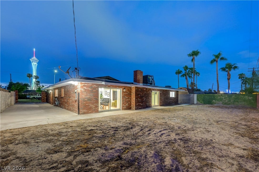2101 Santiago Street, Las Vegas, NV 89104 Mid-century brick architecture stands out against a twilight sky with iconic tower views.