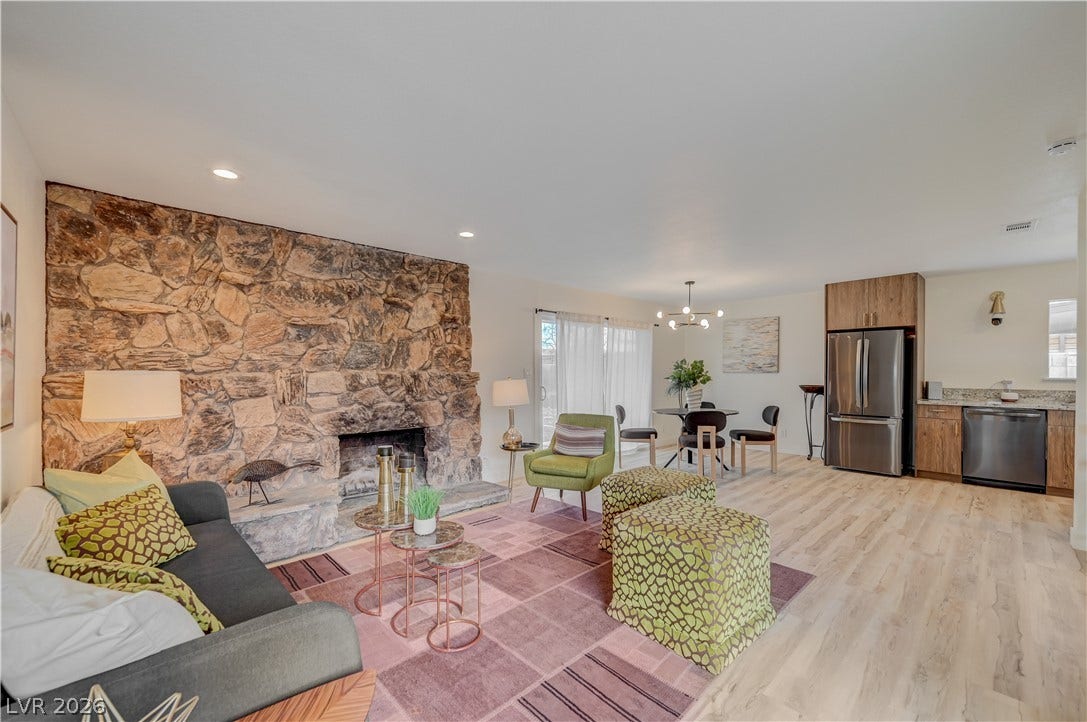 2101 Santiago Street, Las Vegas, NV 89104 An open floor plan connects the living area and its stone fireplace to the kitchen.