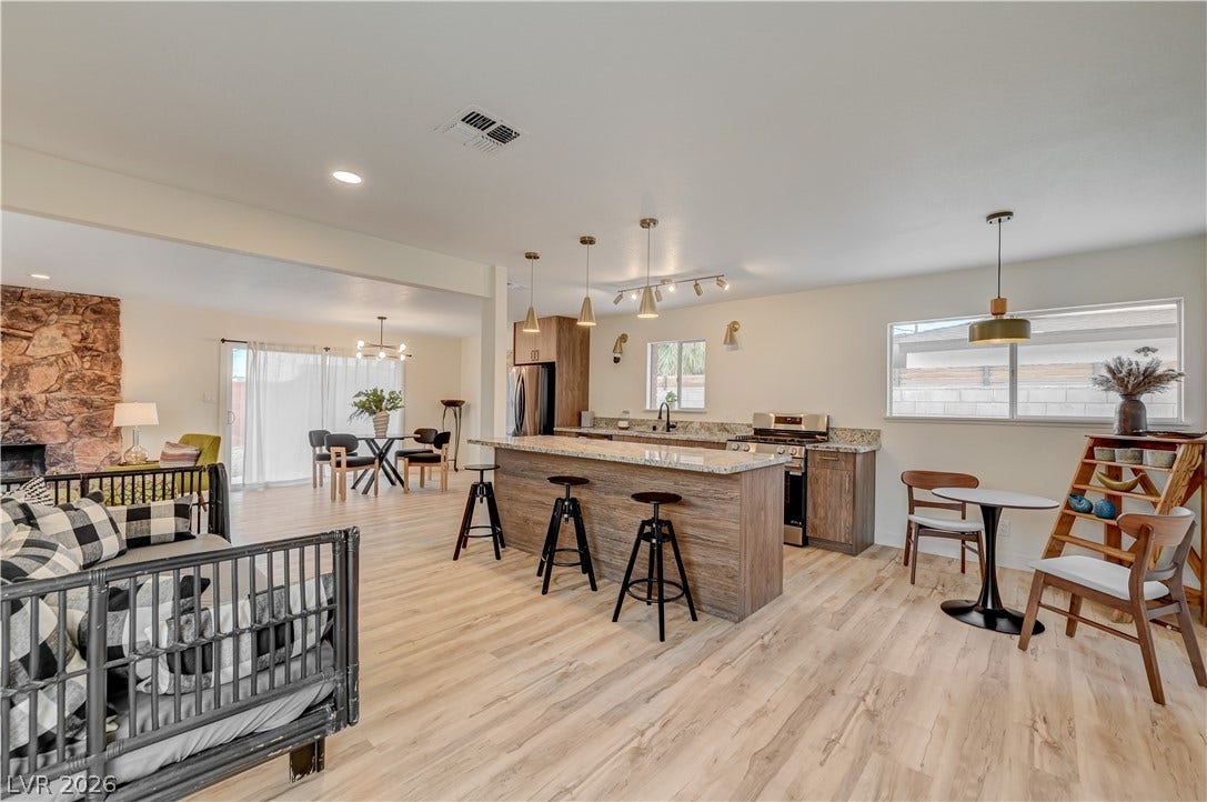 2101 Santiago Street, Las Vegas, NV 89104 An open floorplan seamlessly connects the contemporary kitchen to the light-filled dining and living areas.