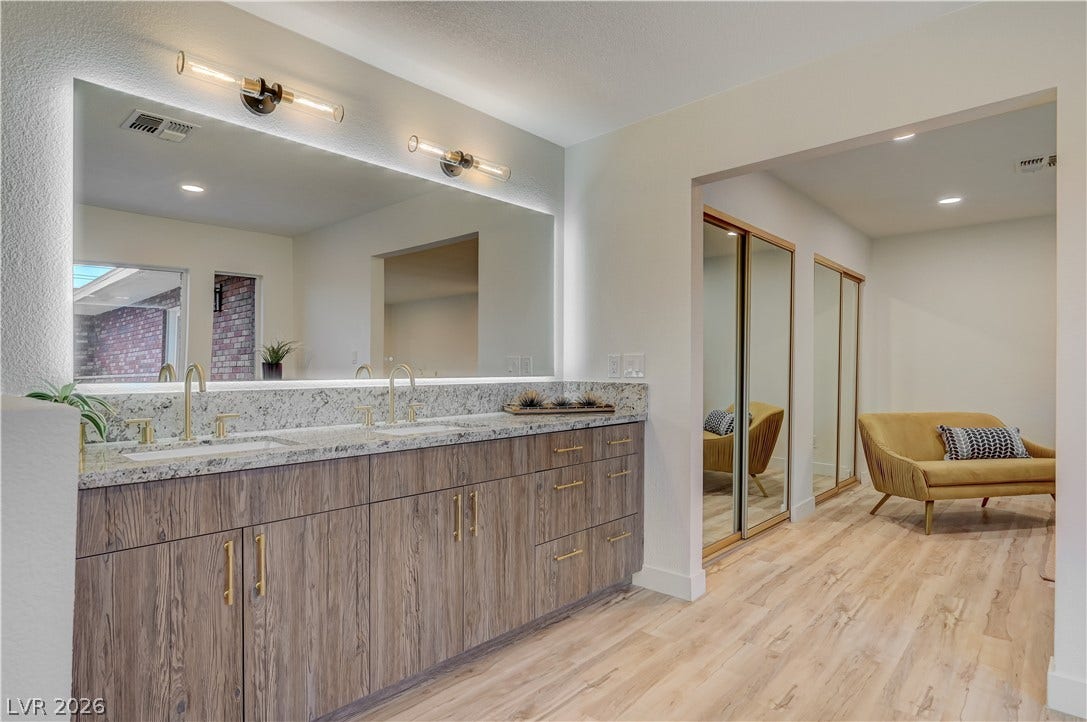 2101 Santiago Street, Las Vegas, NV 89104 Clean lines and a spacious dual vanity define this elegant primary bathroom retreat.