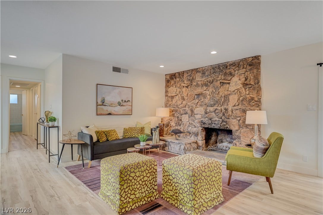 2101 Santiago Street, Las Vegas, NV 89104 An impressive floor-to-ceiling stone fireplace serves as the centerpiece of this light-filled room.