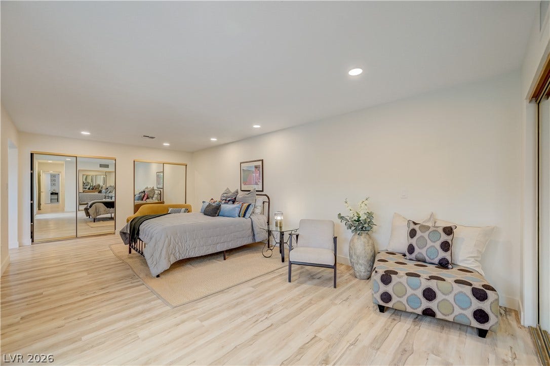 2101 Santiago Street, Las Vegas, NV 89104 Smooth wood flooring and recessed lighting define this generously proportioned bedroom space.