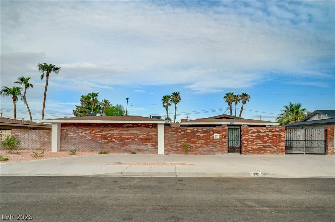 2101 Santiago Street, Las Vegas, NV 89104 Midcentury architectural lines pair with a classic brick facade and integrated privacy walls.