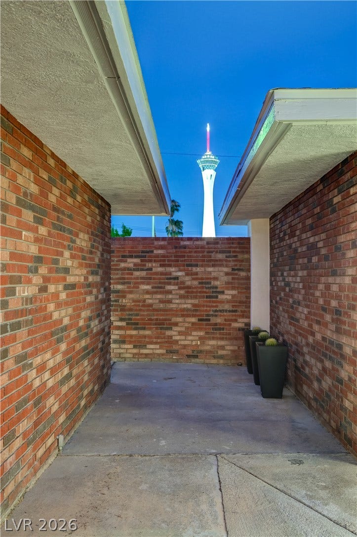 2101 Santiago Street, Las Vegas, NV 89104 Brick walls frame a private courtyard featuring an iconic view of the Stratosphere tower.