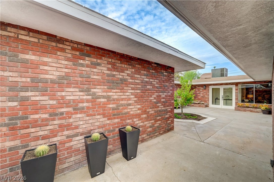 2101 Santiago Street, Las Vegas, NV 89104 Brick siding and a concrete courtyard create a classic low-maintenance exterior design.