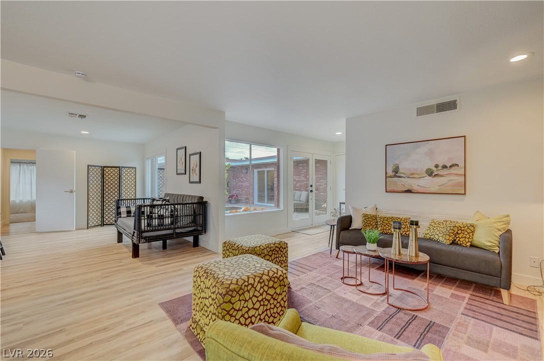 2101 Santiago Street, Las Vegas, NV 89104 Smooth plaster walls and warm wood flooring define this inviting, open-plan living area.