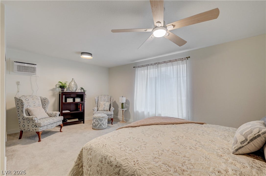 2101 Santiago Street, Las Vegas, NV 89104 Plentiful natural light fills this comfortable bedroom featuring soft carpeting and large windows.