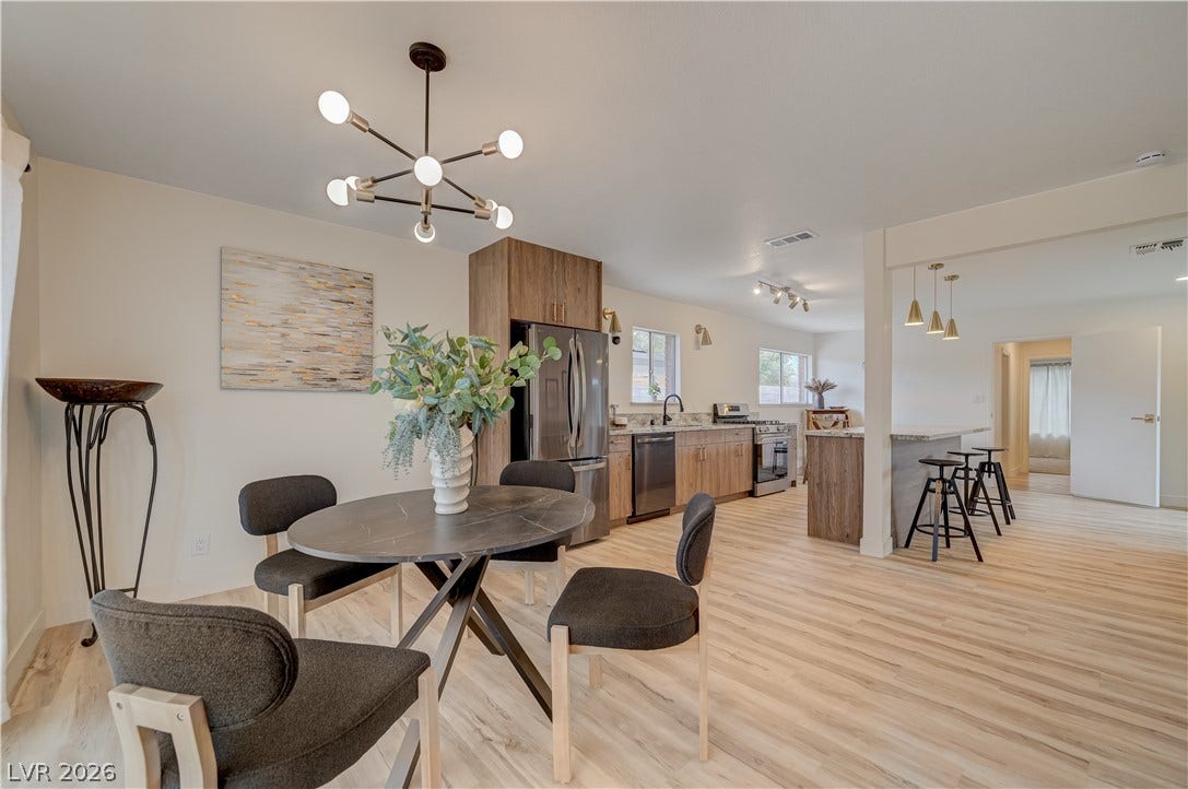 2101 Santiago Street, Las Vegas, NV 89104 Gleaming wood floors connect the casual dining area directly to a modern, open-concept kitchen.