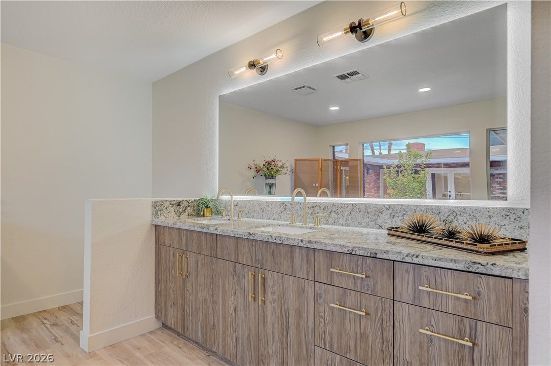 2101 Santiago Street, Las Vegas, NV 89104 Double vanities with stone counters highlight this beautifully designed space.