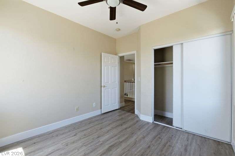 10464 Calico Pines Avenue, Las Vegas, NV 89135 Smooth wood-look flooring and a built-in closet anchor this versatile secondary bedroom space.
