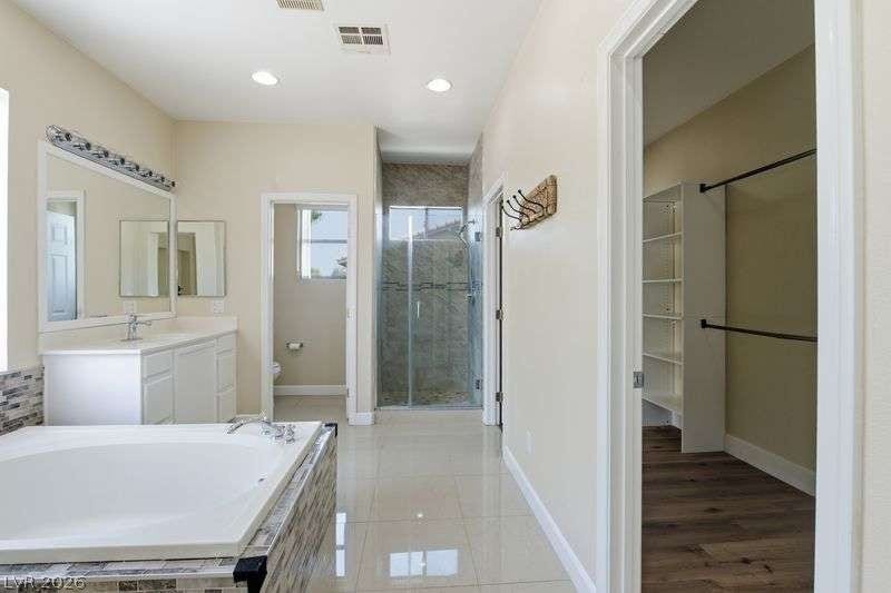 10464 Calico Pines Avenue, Las Vegas, NV 89135 A spacious layout connects the primary bath features with an adjacent walk-in closet.