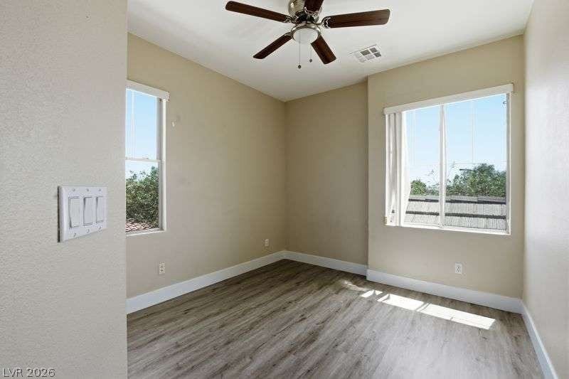 10464 Calico Pines Avenue, Las Vegas, NV 89135 Hardwood floors and dual-aspect windows define this versatile room.