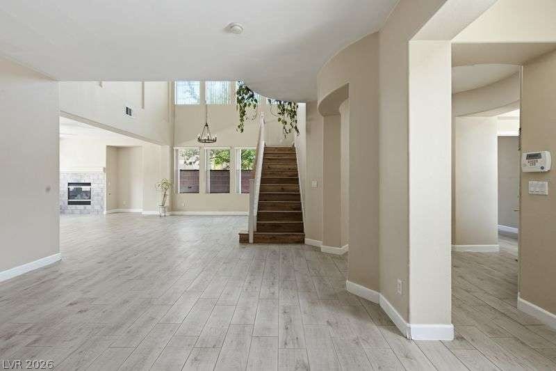 10464 Calico Pines Avenue, Las Vegas, NV 89135 Smooth wood-look flooring and soaring double-height ceilings define this open architectural entryway.