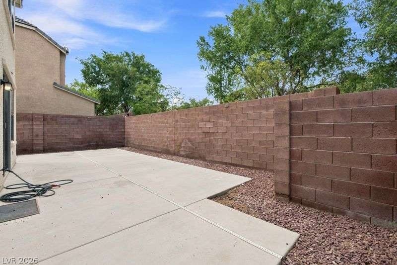 10464 Calico Pines Avenue, Las Vegas, NV 89135 A spacious concrete patio is enclosed by a privacy wall of block masonry.