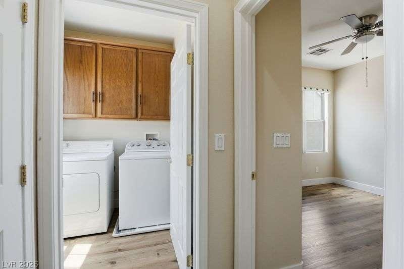 10464 Calico Pines Avenue, Las Vegas, NV 89135 A dedicated laundry room and adjacent bedroom showcase classic wood flooring and storage cabinetry.