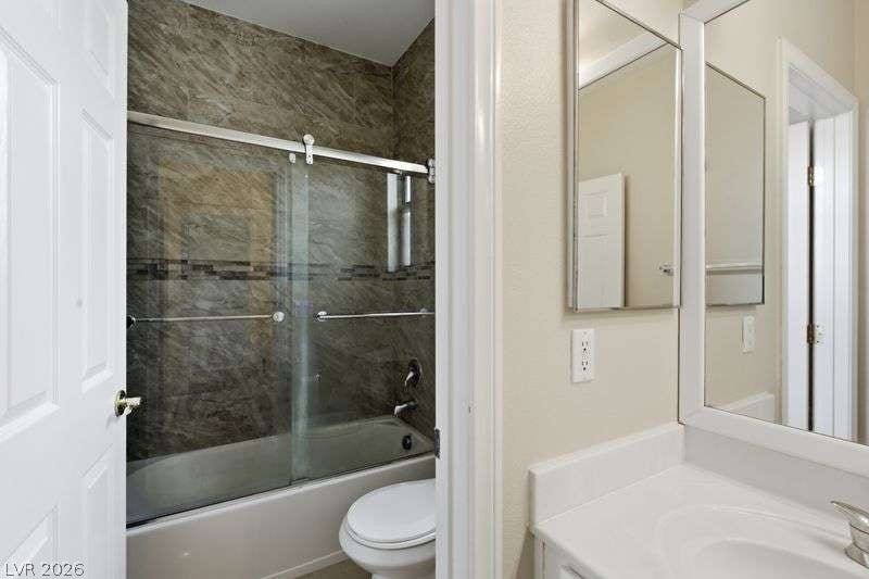 10464 Calico Pines Avenue, Las Vegas, NV 89135 A classic tub and shower combination with custom tile surround sits adjacent to the vanity area.