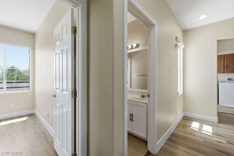 10464 Calico Pines Avenue, Las Vegas, NV 89135 Hardwood floors and clean white trim connect seamlessly across a practical hallway layout.