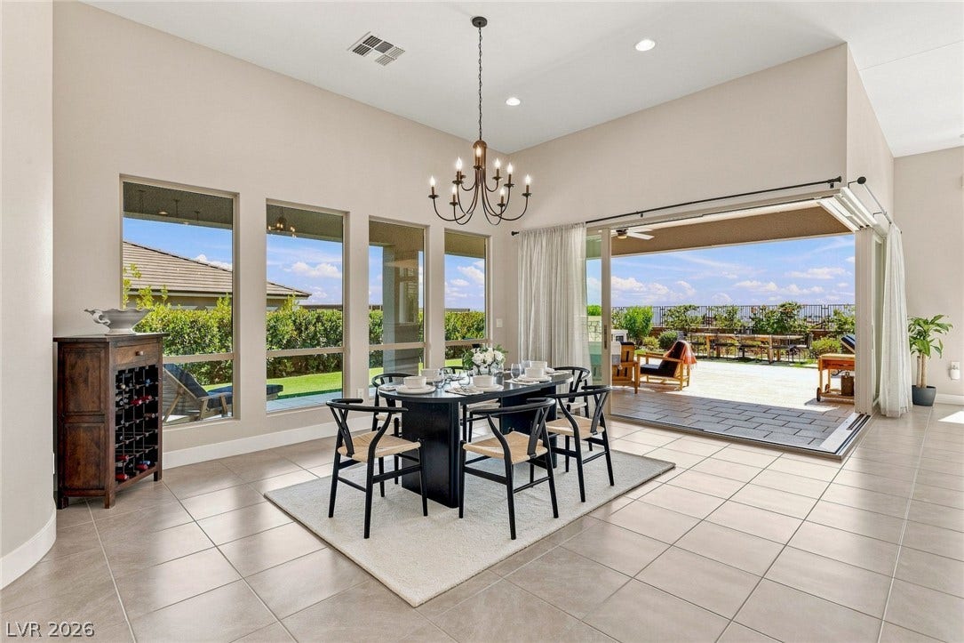 An open floorplan seamlessly connects the airy kitchen to the large dining area. Corner slider opens to your endless mountain views.
