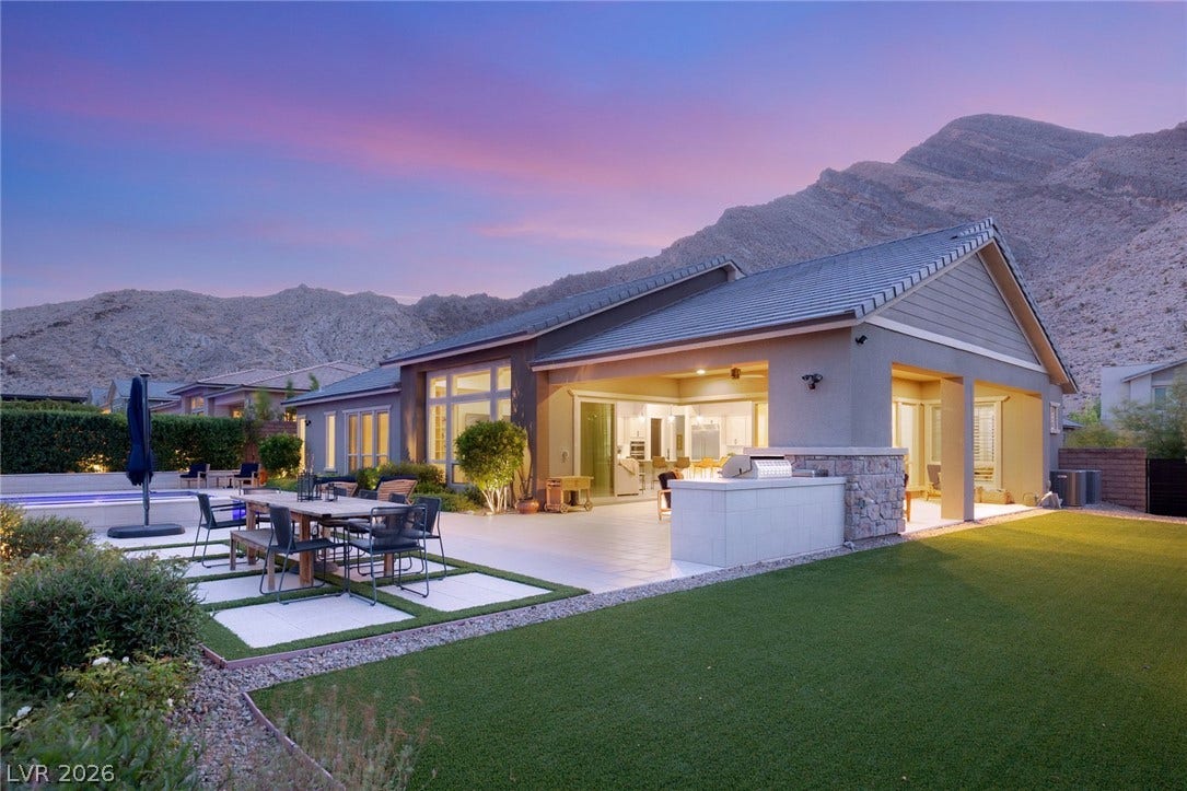 Dramatic mountain views provide a breathtaking backdrop for this modern desert oasis.
