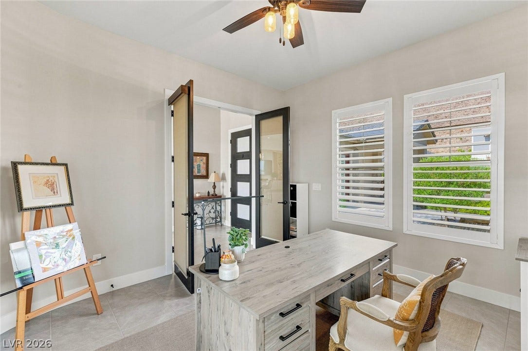 Double doors open to a serene workspace complete.