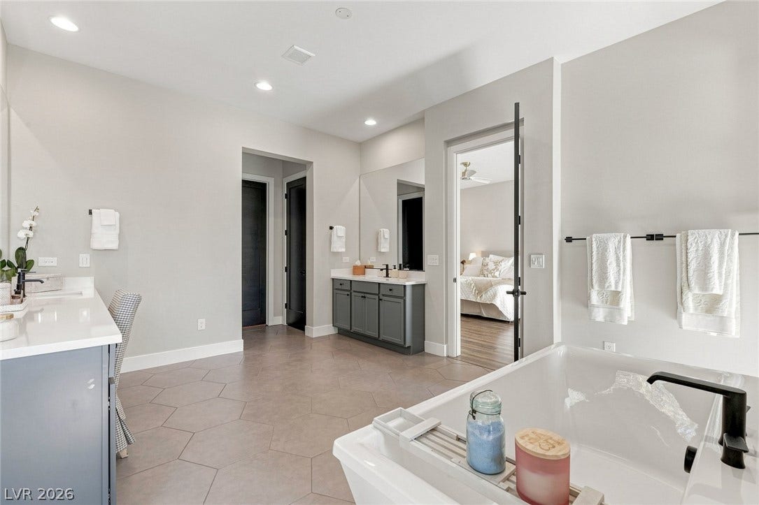 Luxurious soaking tub in this elegant primary bathroom retreat.