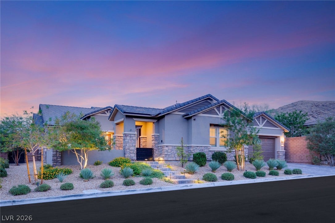 Exquisite desert landscaping  frame this modern single-story residence. Beautiful curb appeal.