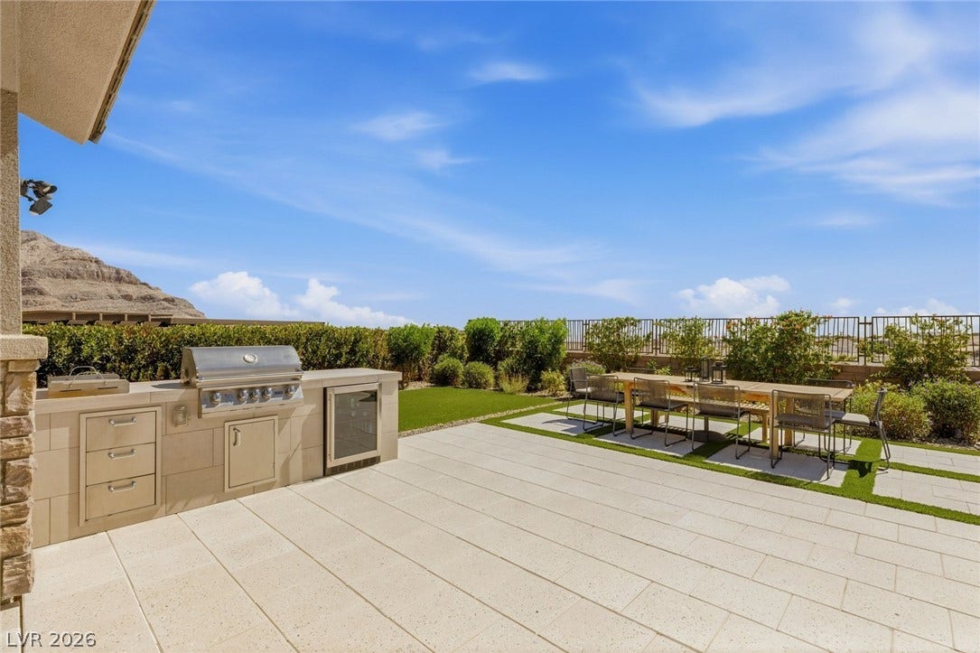 Outdoor BBQ, dining and large turf area for relaxing.