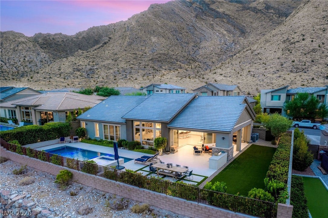 Dramatic mountain vistas rise directly behind this contemporary single-level residence featuring a private swimming pool and spa.