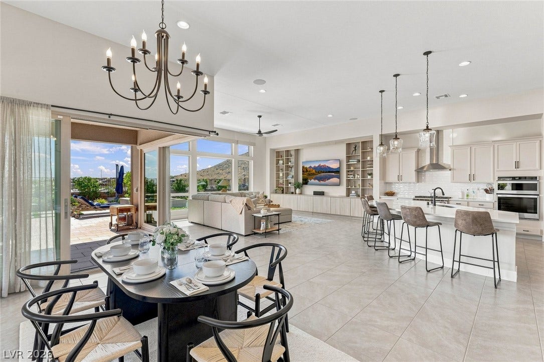 An open floorplan seamlessly connects the airy kitchen to the large dining area. Corner slider opens to your endless mountain views.