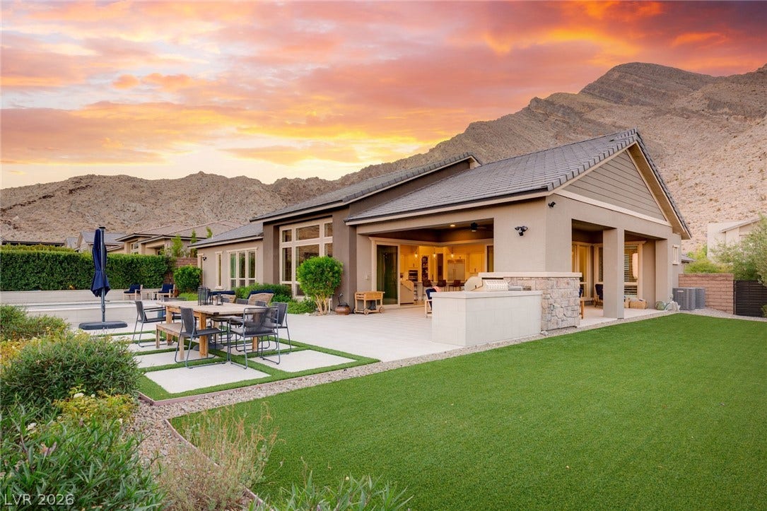 Dramatic mountain views provide a breathtaking backdrop for this gorgeoud backyard.
