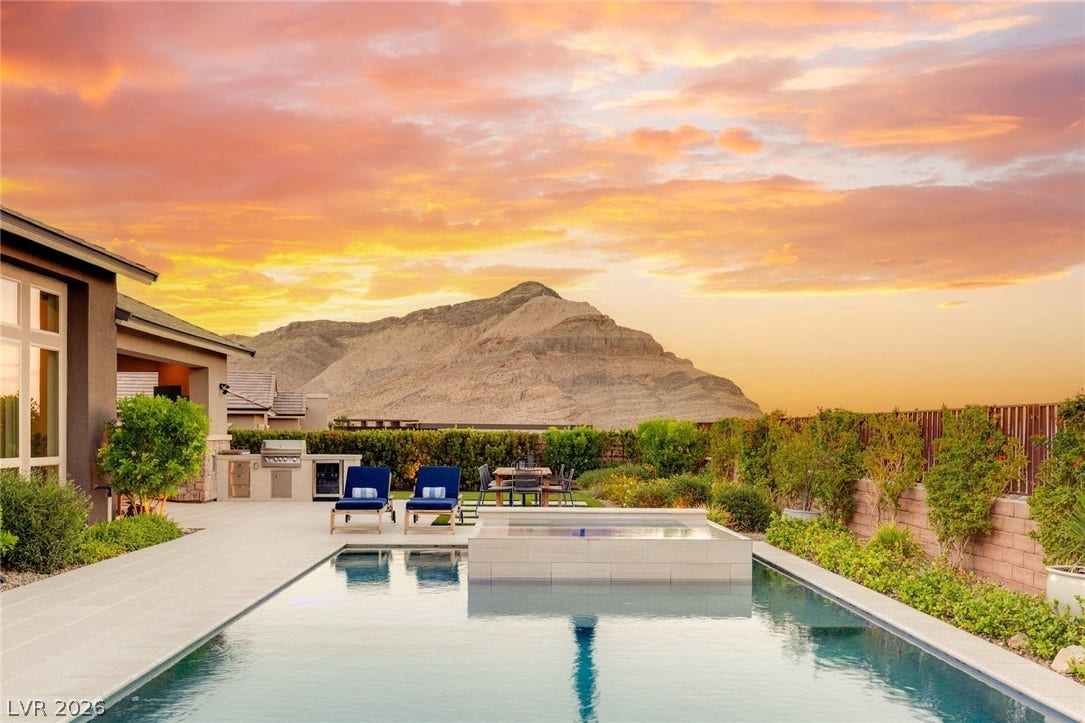 Dramatic mountain views provide a breathtaking backdrop for this gorgeoud backyard.