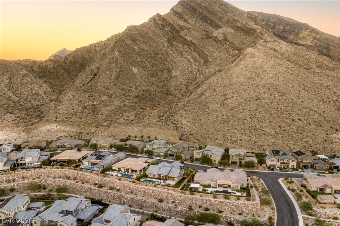 Dramatic mountain backdrops frame this modern desert home