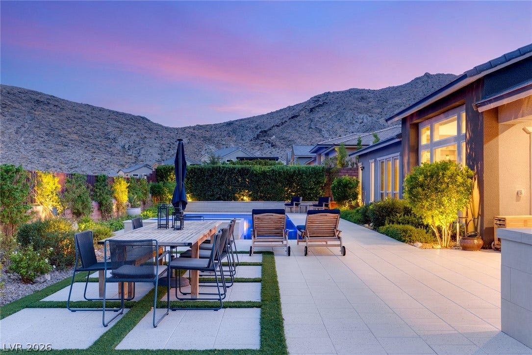 Dramatic mountain vistas provide a breathtaking backdrop for the private pool and expansive patio.