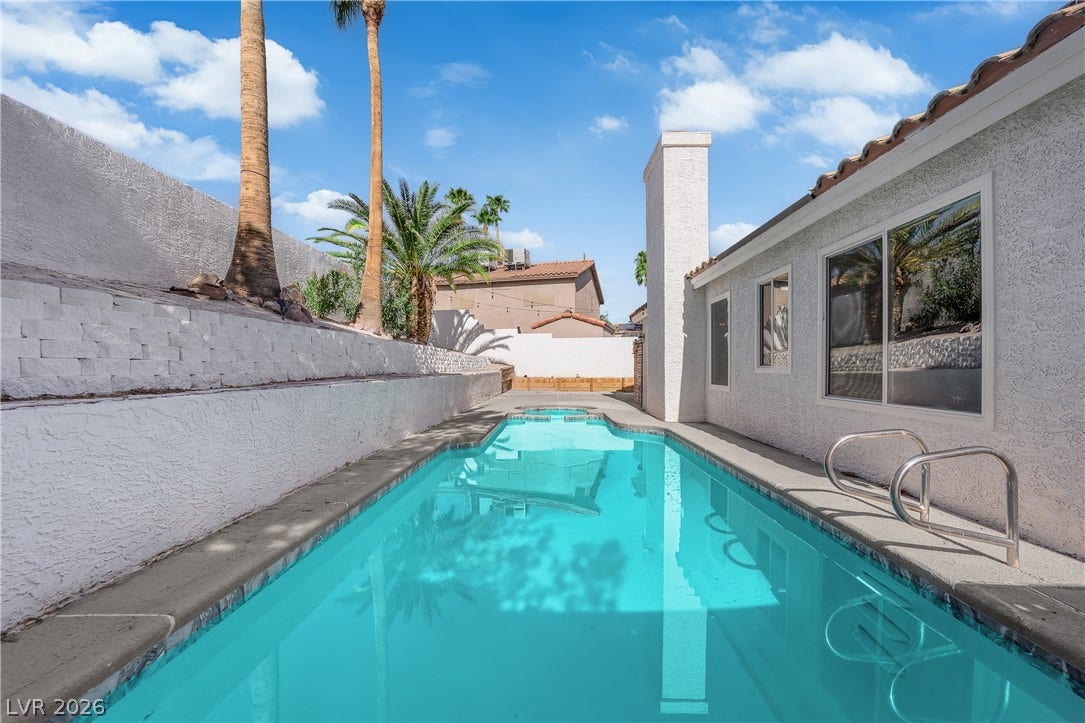 1433 Pathfinder Road, Henderson, NV 89014 A sparkling swimming pool highlights this private backyard space enclosed by stucco walls.