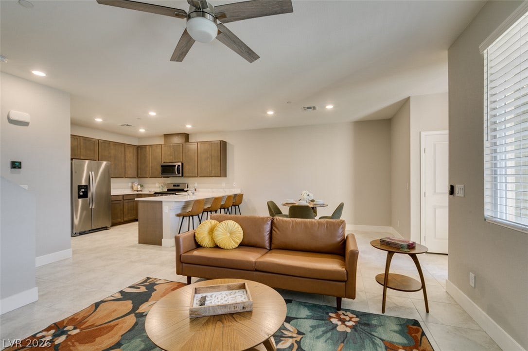3179 Brynley Avenue, Henderson, NV 89044 Tile flooring and recessed lighting connect this open-plan layout to the adjacent kitchen.