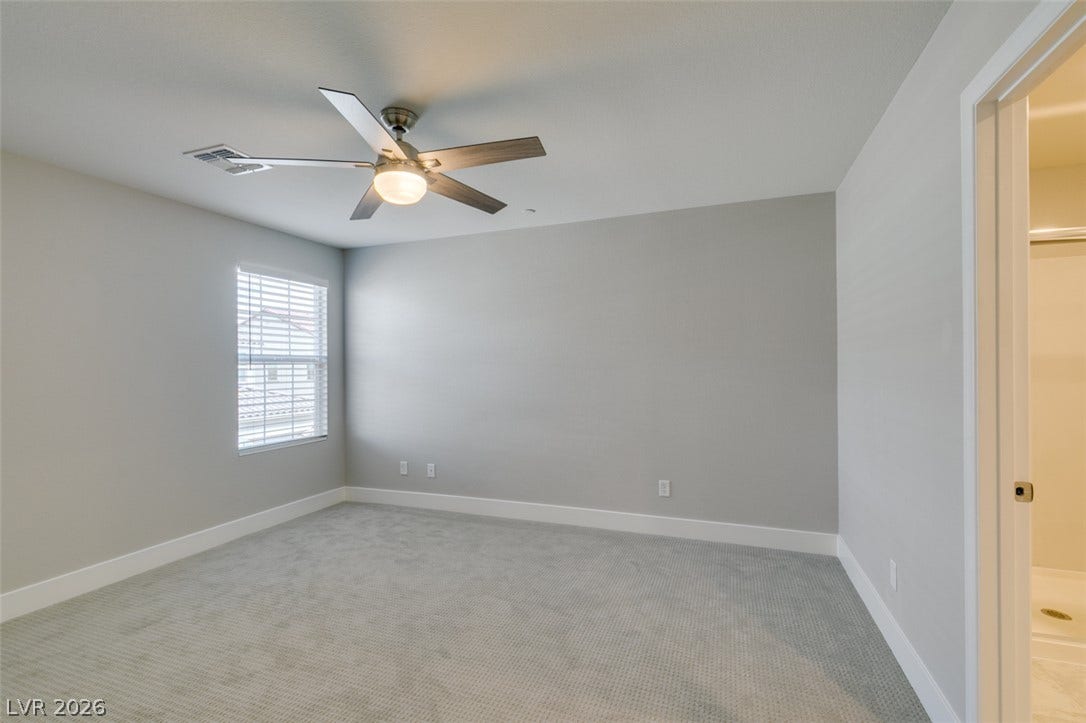 3179 Brynley Avenue, Henderson, NV 89044 Soft carpet and clean plaster walls define this comfortable secondary bedroom.