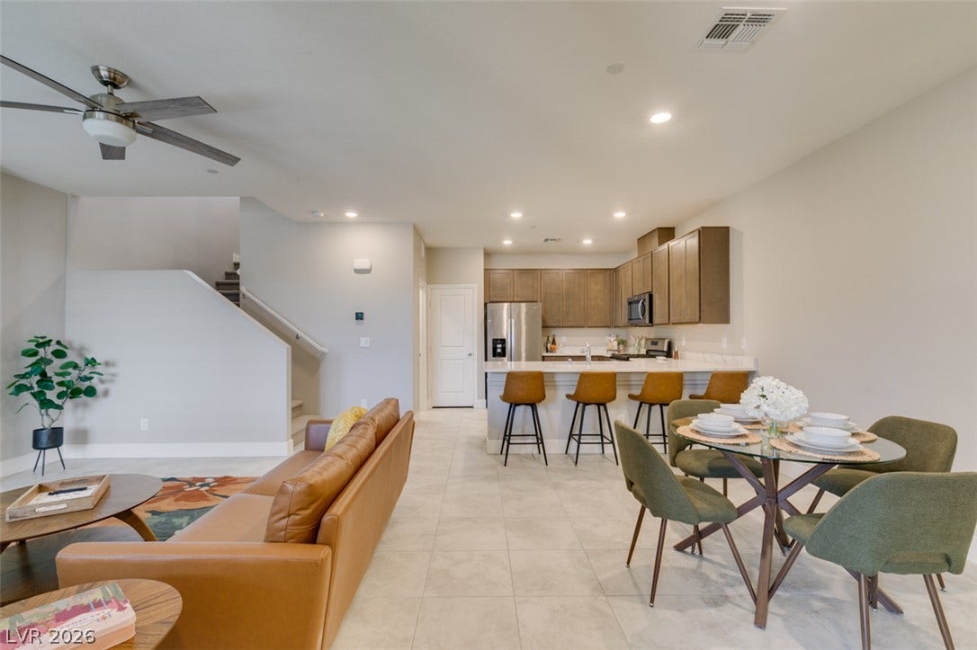 3179 Brynley Avenue, Henderson, NV 89044 An open floor plan seamlessly connects the kitchen and dining space over large-format tile flooring.
