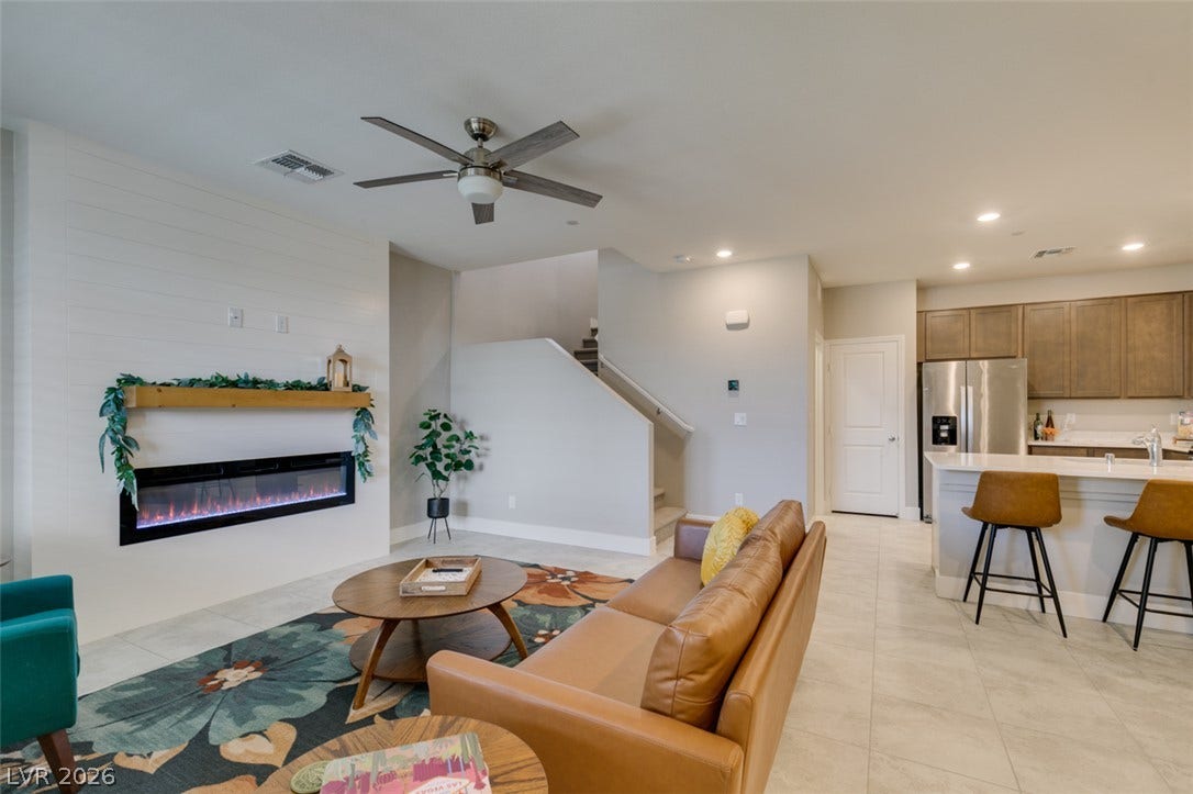 3179 Brynley Avenue, Henderson, NV 89044 An open floor plan connects the comfortable living area to a modern kitchen.
