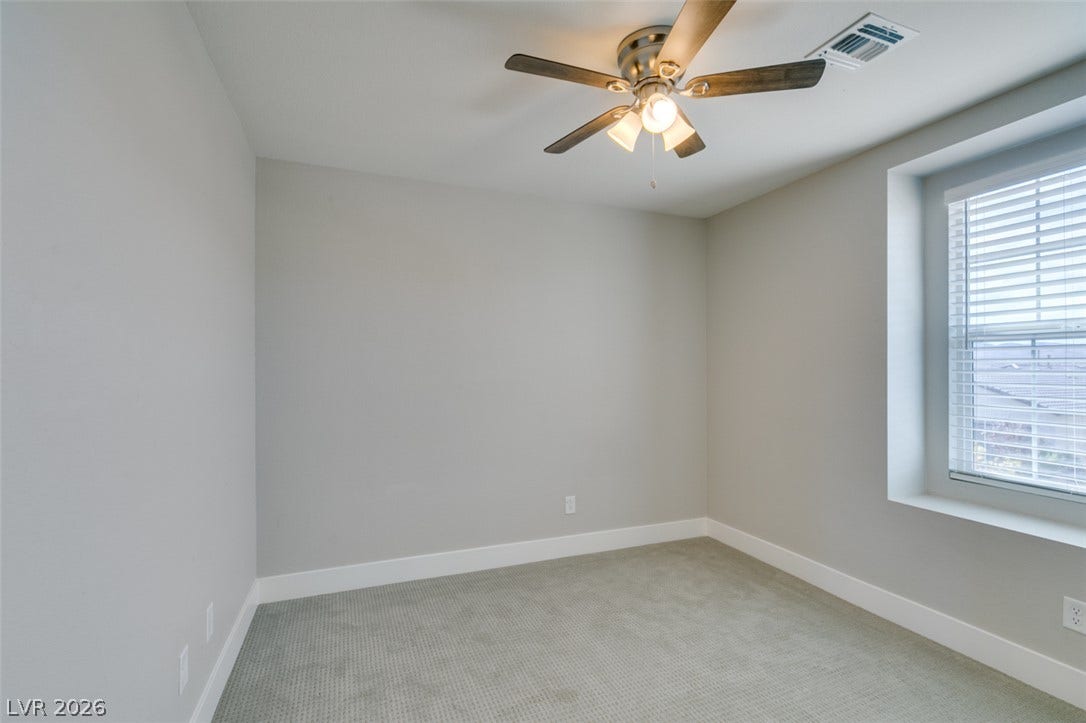 3179 Brynley Avenue, Henderson, NV 89044 Plush carpeted flooring and a deep window sill define this versatile room.