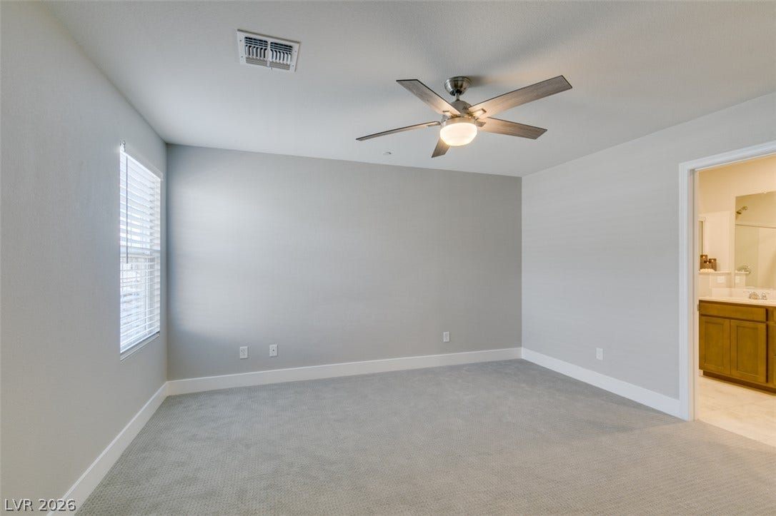 3179 Brynley Avenue, Henderson, NV 89044 Soft carpet and clean architectural lines define this comfortable bedroom suite.