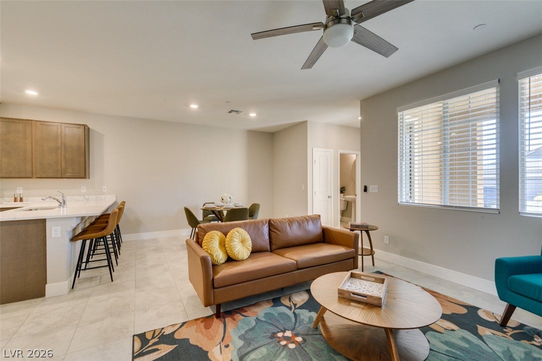 3179 Brynley Avenue, Henderson, NV 89044 An open floorplan seamlessly connects the comfortable living area with the modern kitchen and dining space.