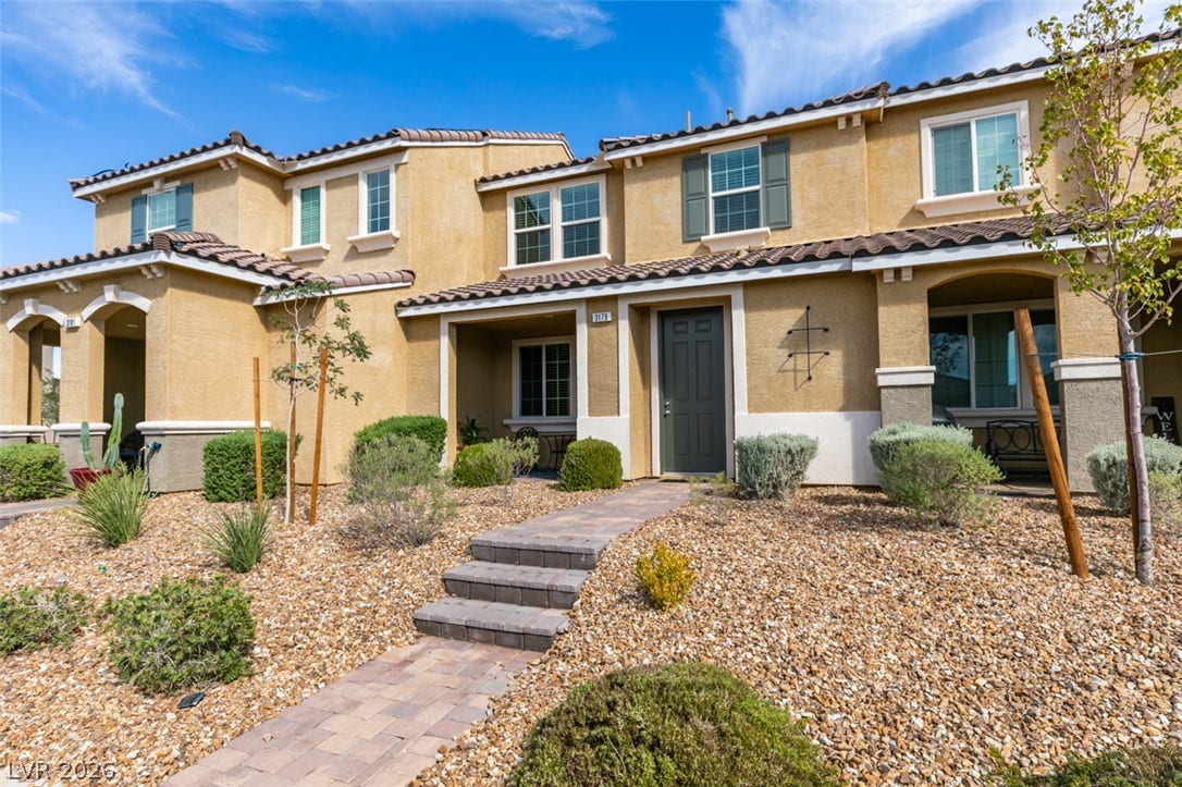3179 Brynley Avenue, Henderson, NV 89044 Spanish tile roofing and stone-paved stairs accent the stucco exterior of this multi-level home.