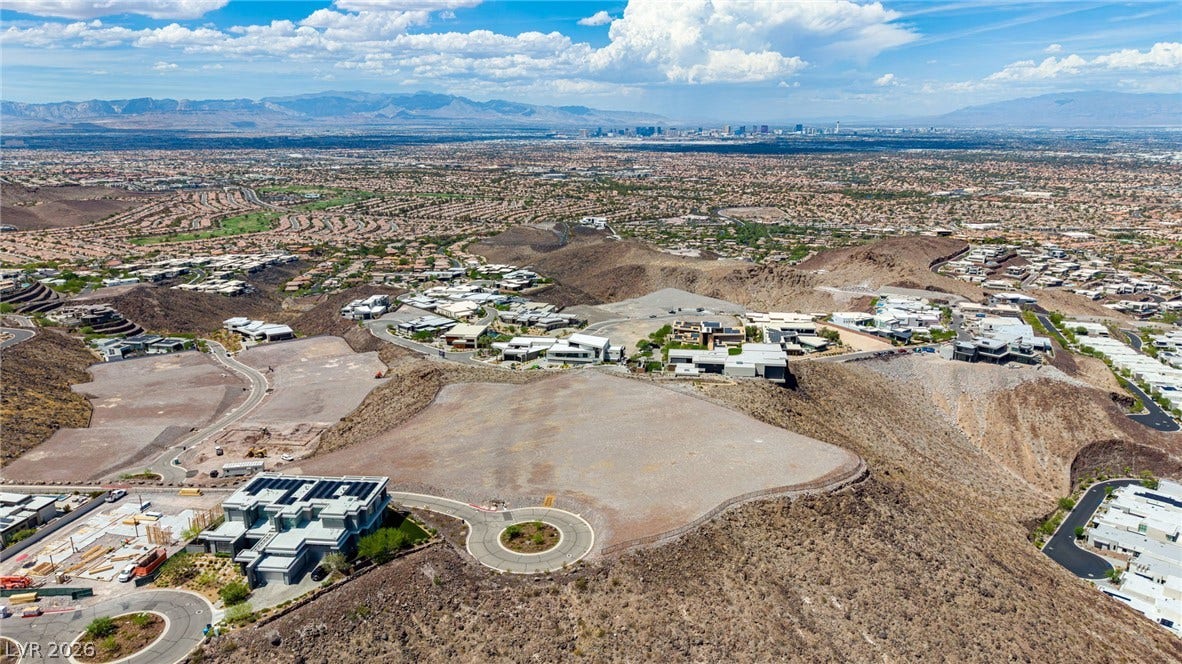 2 Epic View Court, Henderson, NV 89012 An elevated perspective captures the expansive desert terrain with sweeping mountain and city skyline views.