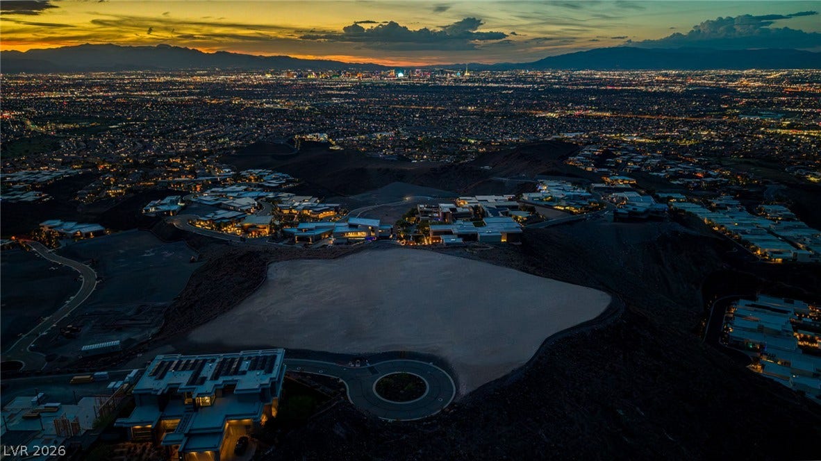 2 Epic View Court, Henderson, NV 89012 Panoramic mountain and sparkling city views unfold from this elevated hillside setting.