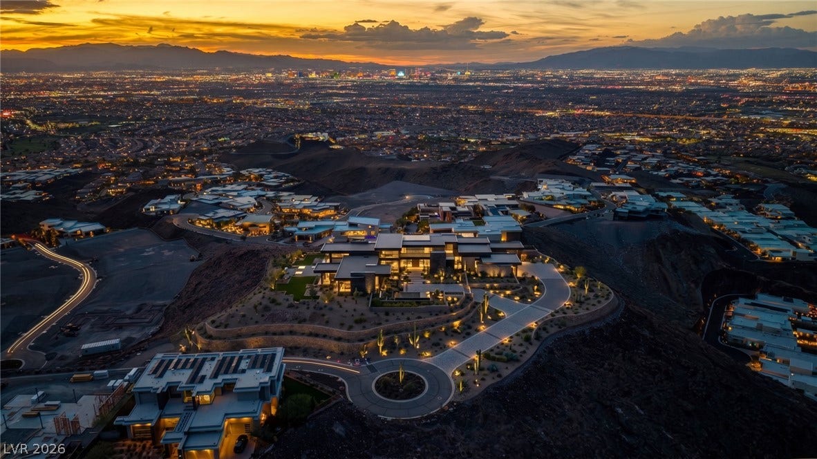 2 Epic View Court, Henderson, NV 89012 Panoramic mountain and city light vistas unfold from this elevated desert hillside setting. Estate rendering on. Sample Architecture added on the lot.