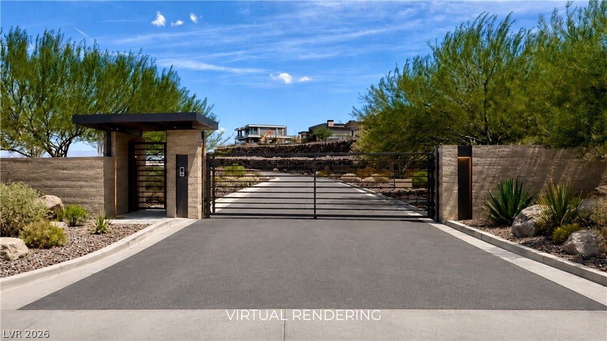 2 Epic View Court, Henderson, NV 89012 A secure gated entrance opens to a paved driveway framed by modern stone walls. Sample private gates to your own 600+ foot long driveway can be added on the lot.